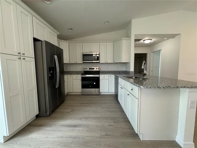 a large kitchen with cabinets