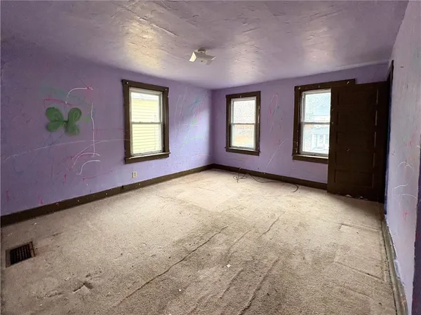 a view of empty room with windows