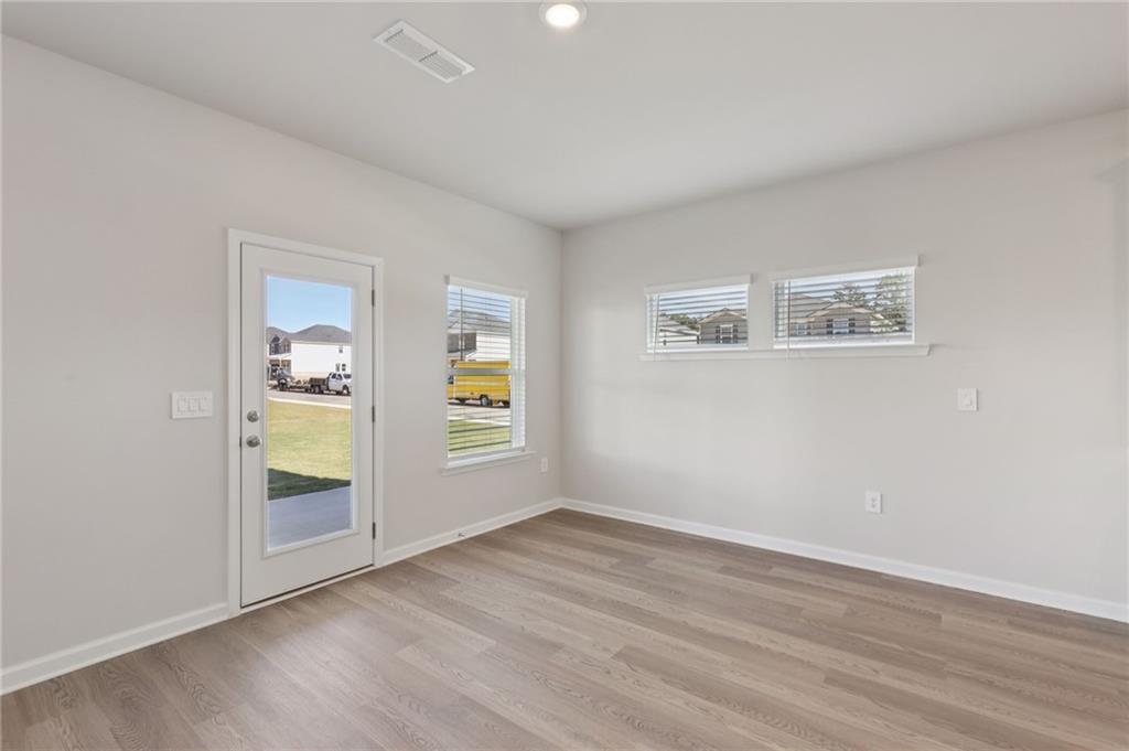 1489 High Fls Lane Grayson, GA 30017 - Photo 11 of 44 an empty room with windows and closet