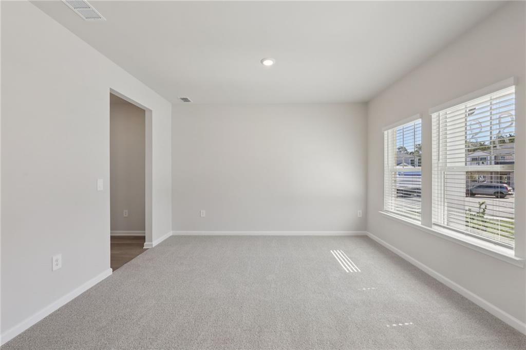 1489 High Fls Lane Grayson, GA 30017 - Photo 15 of 44 a view of an empty room with a window