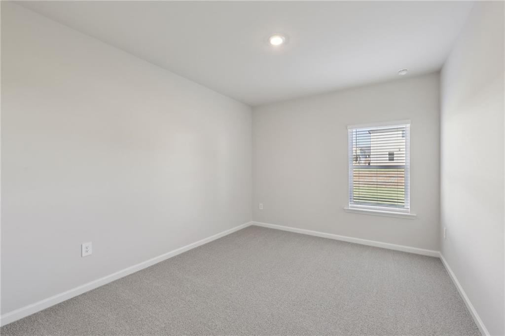 1489 High Fls Lane Grayson, GA 30017 - Photo 20 of 44 a view of an empty room with a window