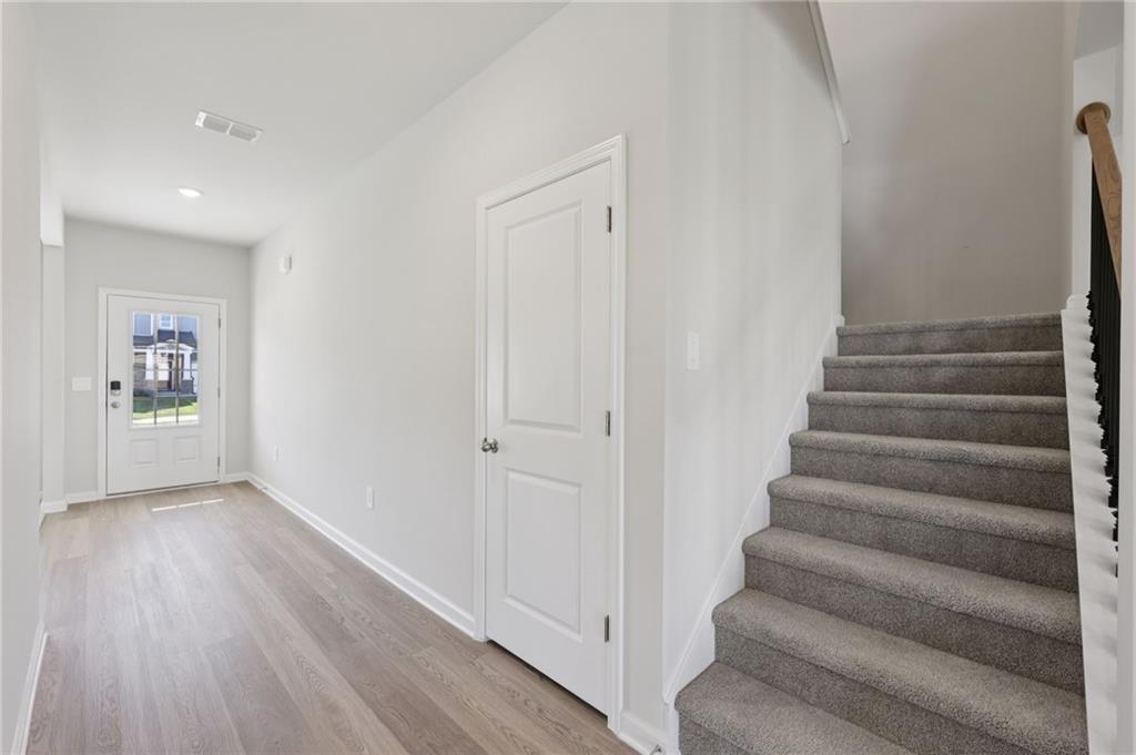 1489 High Fls Lane Grayson, GA 30017 - Photo 22 of 44 a view of an entryway with wooden floor