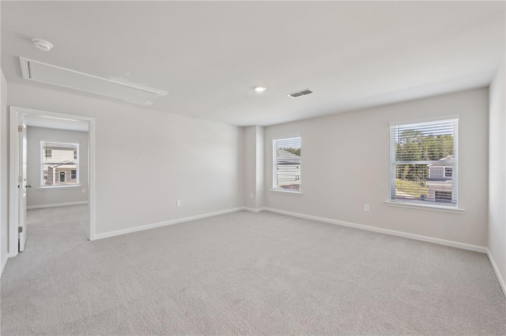 1489 High Fls Lane Grayson, GA 30017 - Photo 23 of 44 an empty room with windows