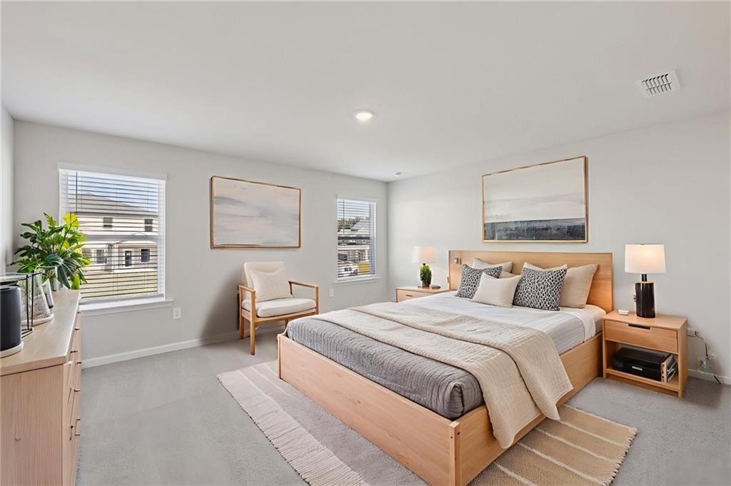 1489 High Fls Lane Grayson, GA 30017 - Photo 26 of 44 a bedroom with a large bed and a window