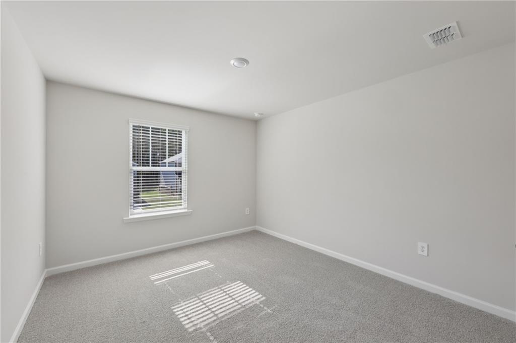 1489 High Fls Lane Grayson, GA 30017 - Photo 37 of 44 an empty room with windows