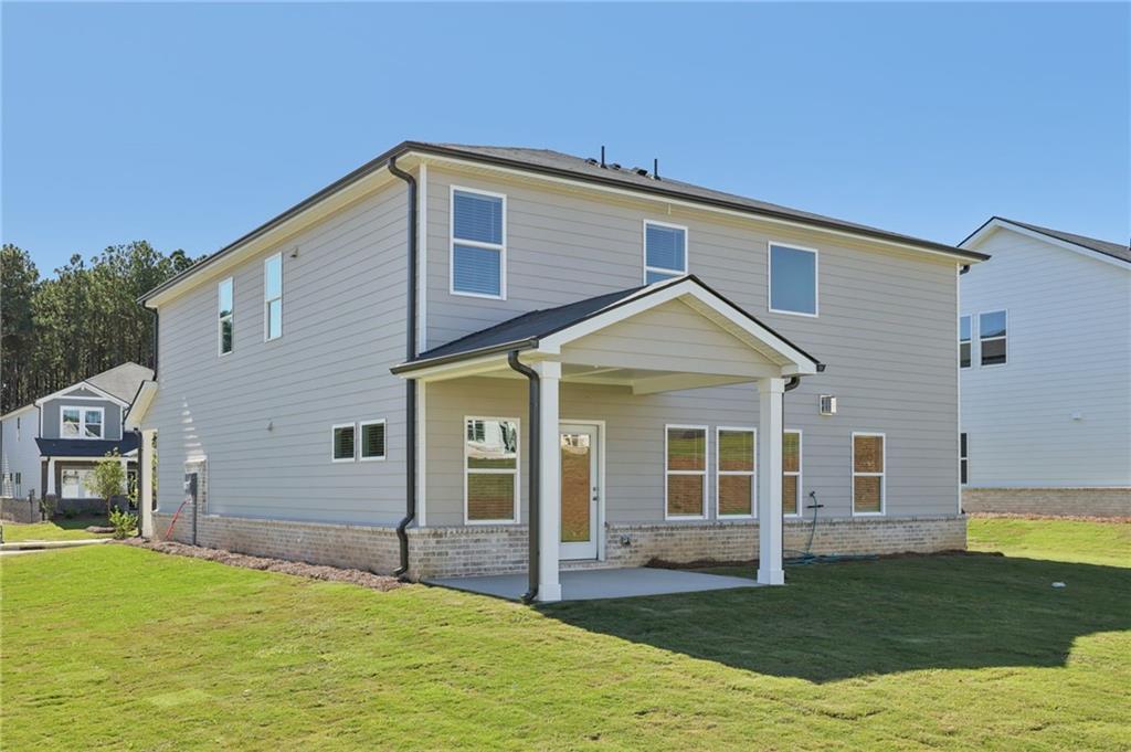 1489 High Fls Lane Grayson, GA 30017 - Photo 42 of 44 a front view of a house with a yard