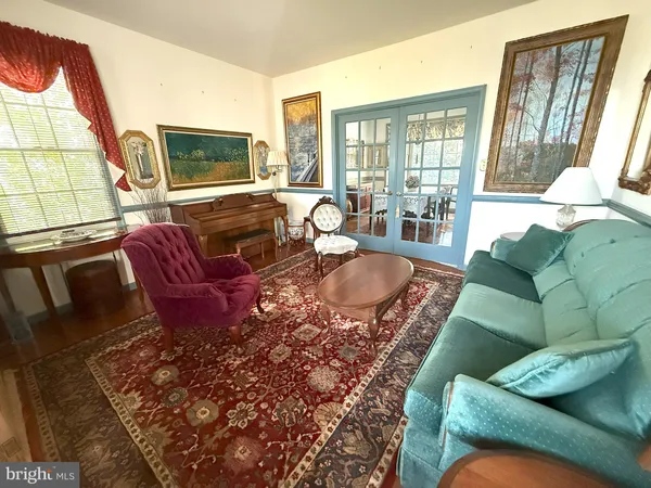 a living room with furniture or couch and a flat screen tv