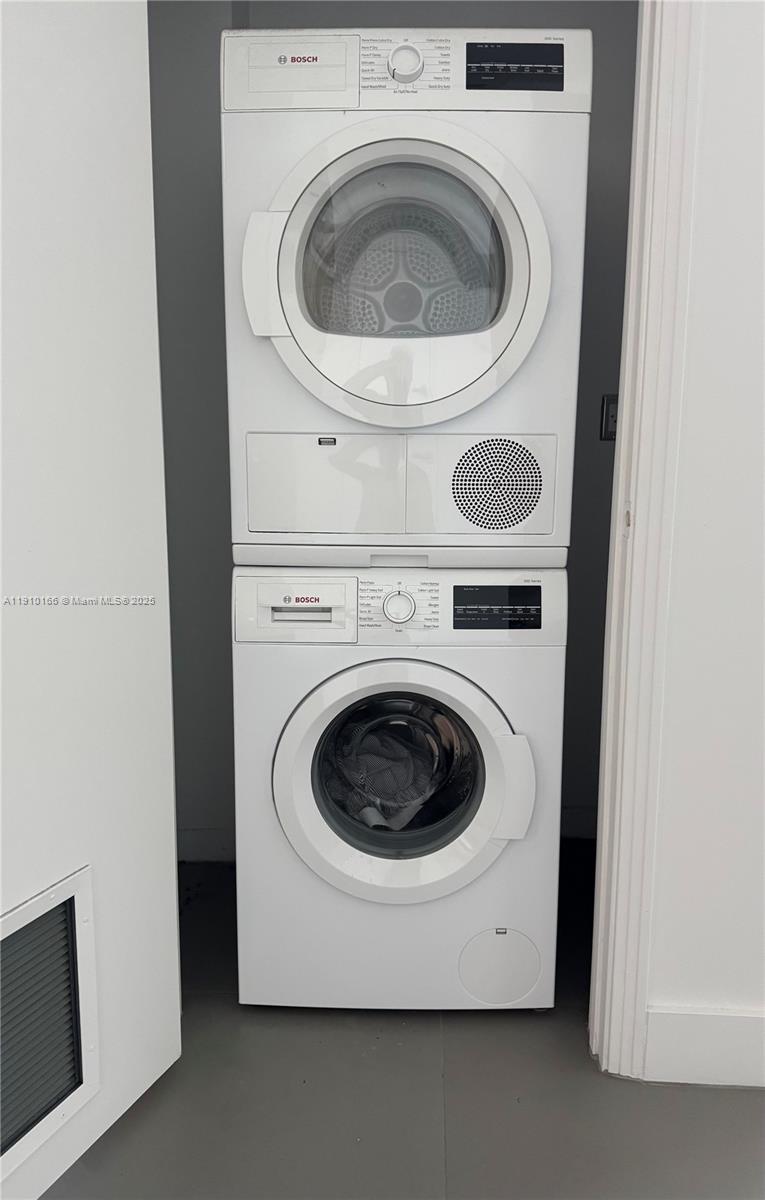9055 Southwest 73rd Court, Unit 406 Miami, FL 33156 - Photo 13 of 18 a utility room with dryer and washer