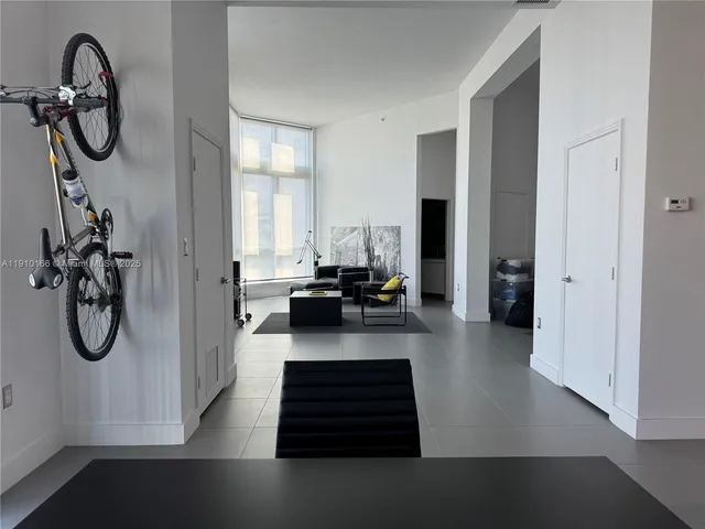 a view of a hallway with stairs