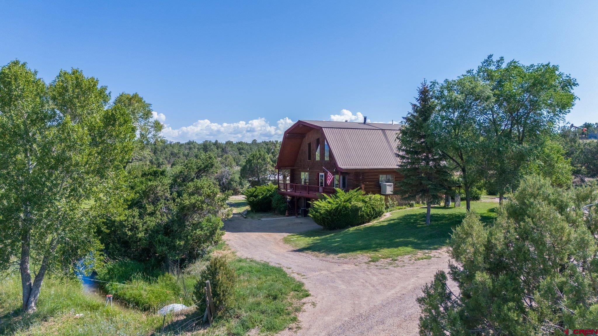 3515 County Road 514 Ignacio, CO 81137 - Photo 1 of 35 a aerial view of a house with a yard and large trees