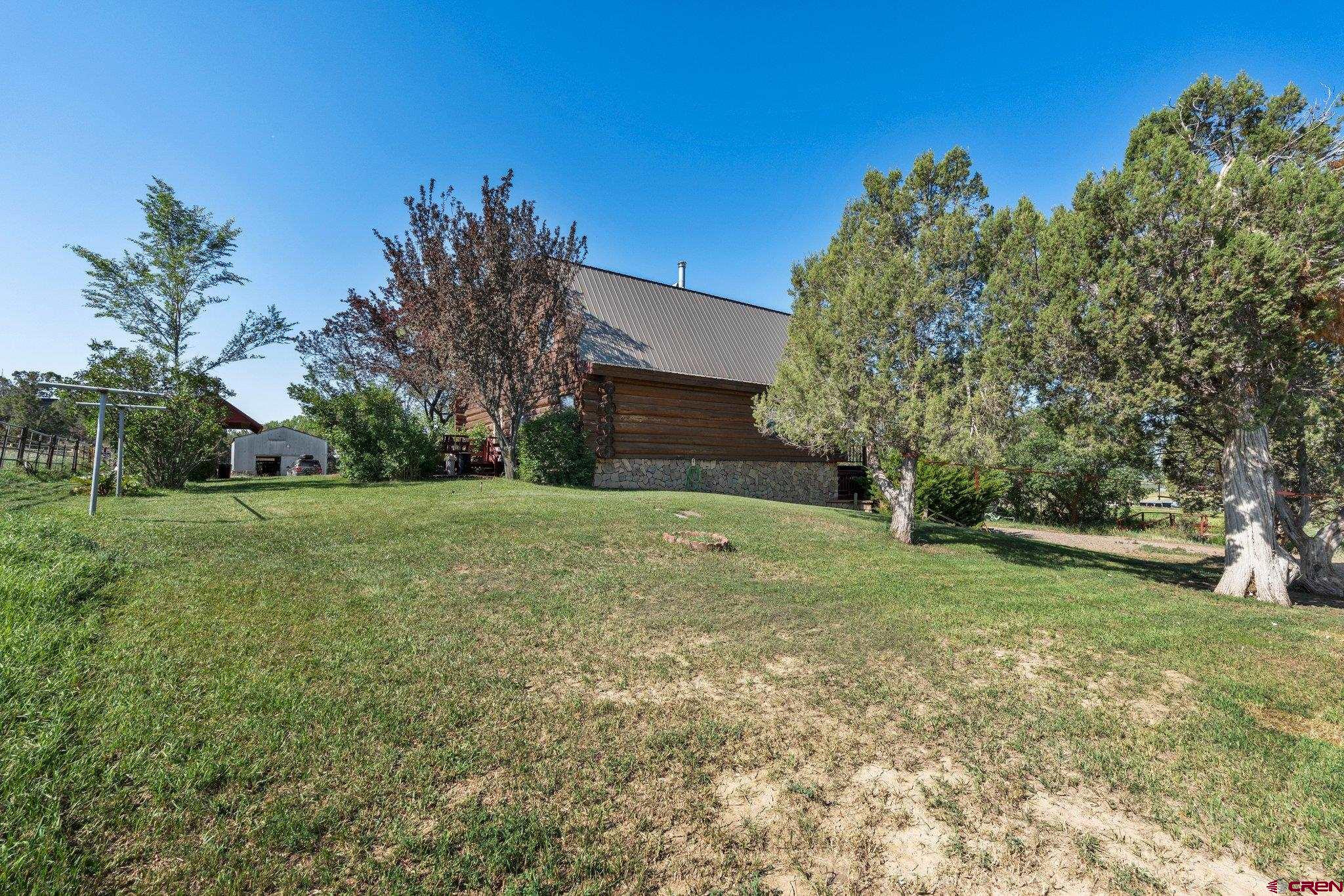 3515 County Road 514 Ignacio, CO 81137 - Photo 2 of 35 a view of a backyard with large trees