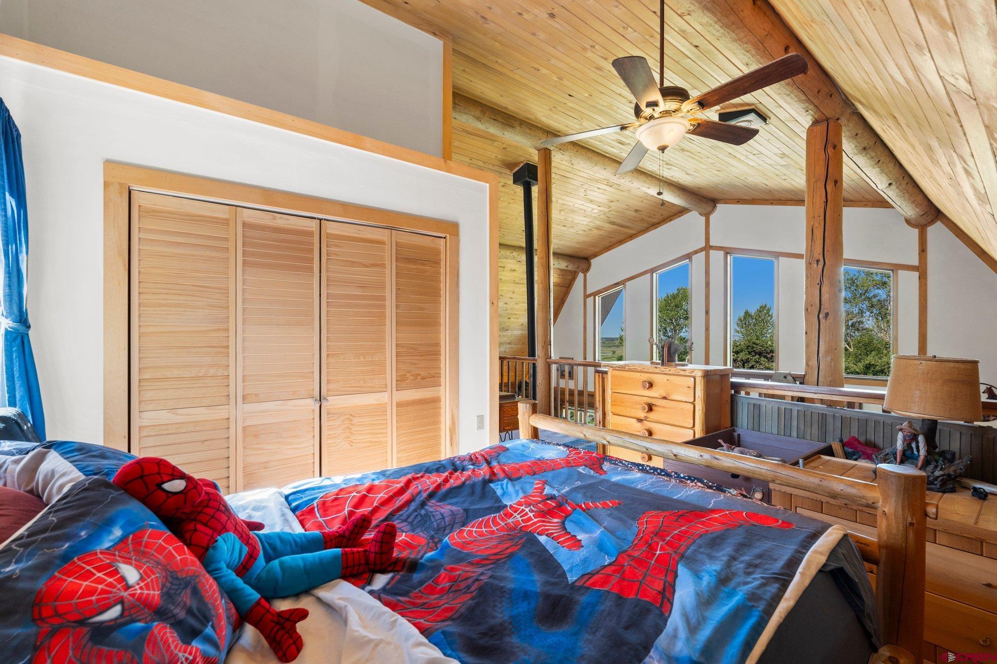 3515 County Road 514 Ignacio, CO 81137 - Photo 21 of 35 a bedroom with a bed and a large window