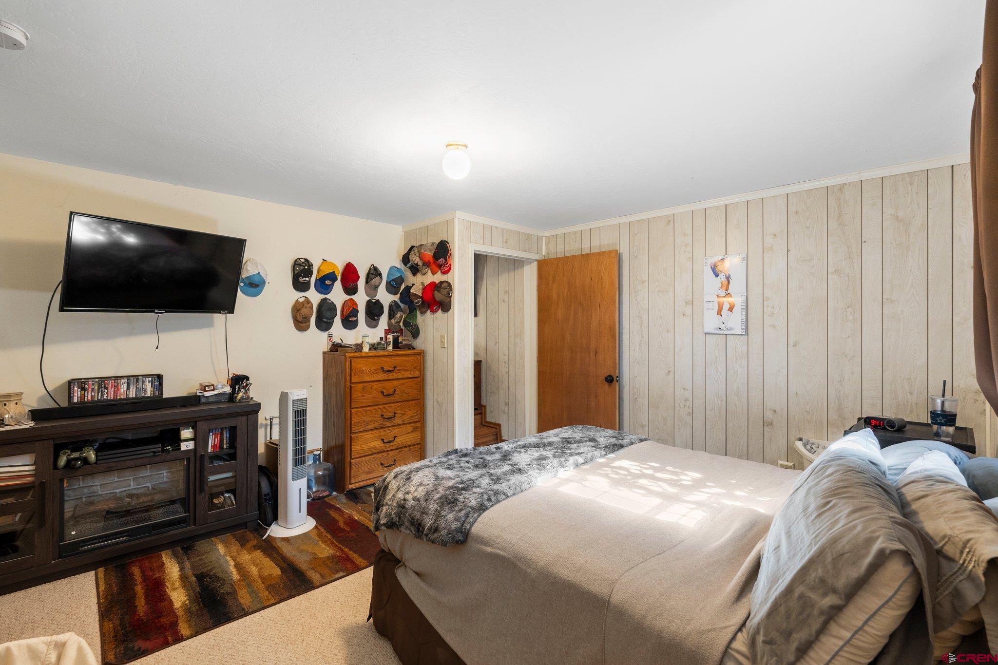 3515 County Road 514 Ignacio, CO 81137 - Photo 25 of 35 a bedroom with a bed and a flat screen tv