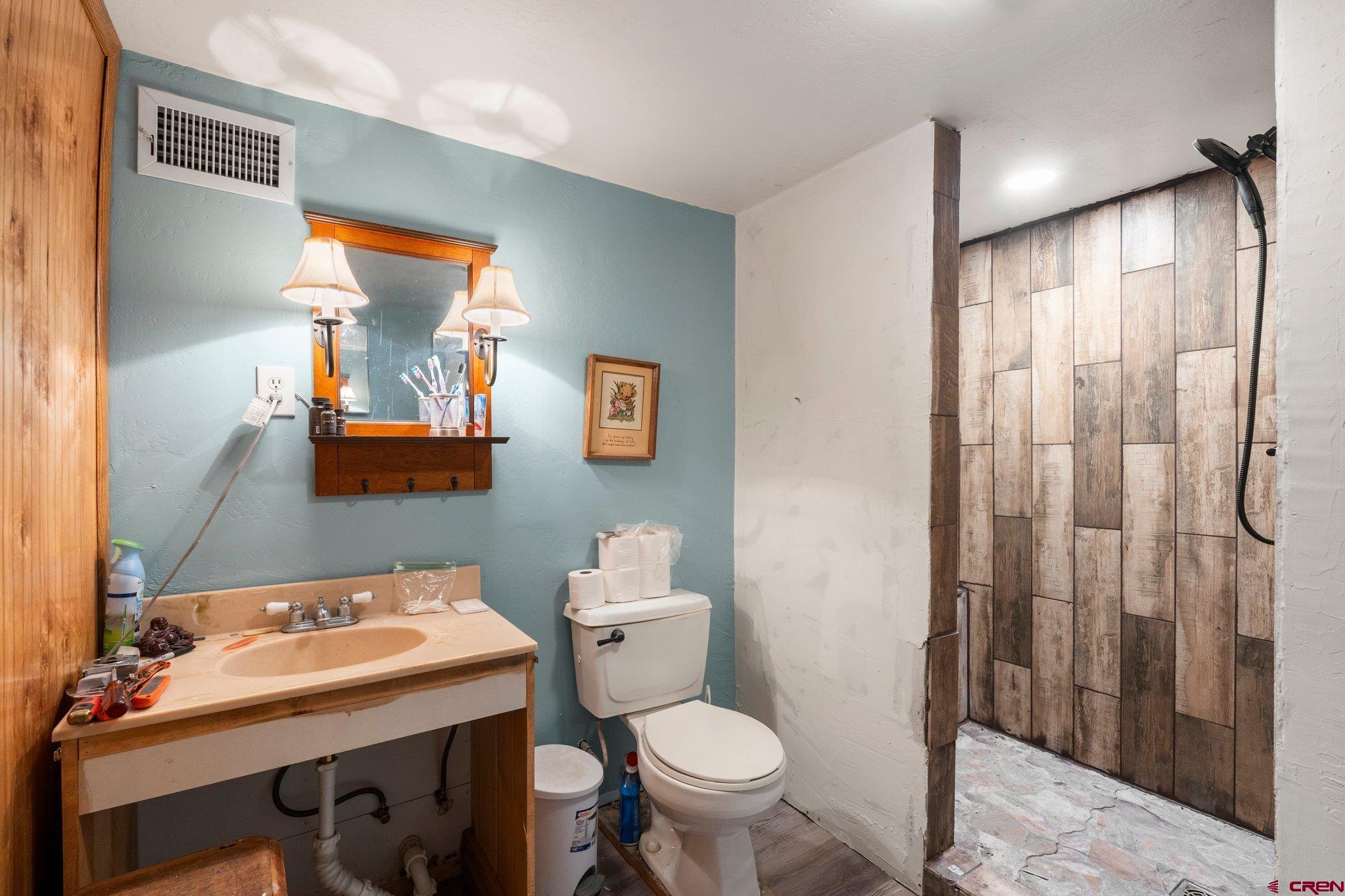 3515 County Road 514 Ignacio, CO 81137 - Photo 26 of 35 a bathroom with a sink and a mirror