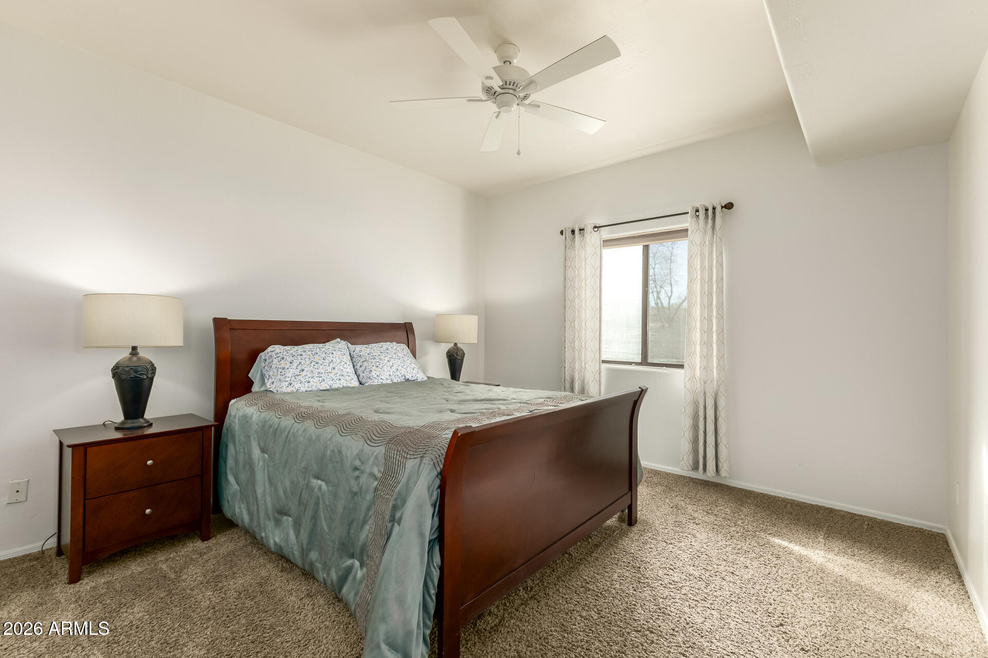 5445 East McKellips Road, Unit 23 Mesa, AZ 85215 - Photo 13 of 32 a bedroom with a bed and a window