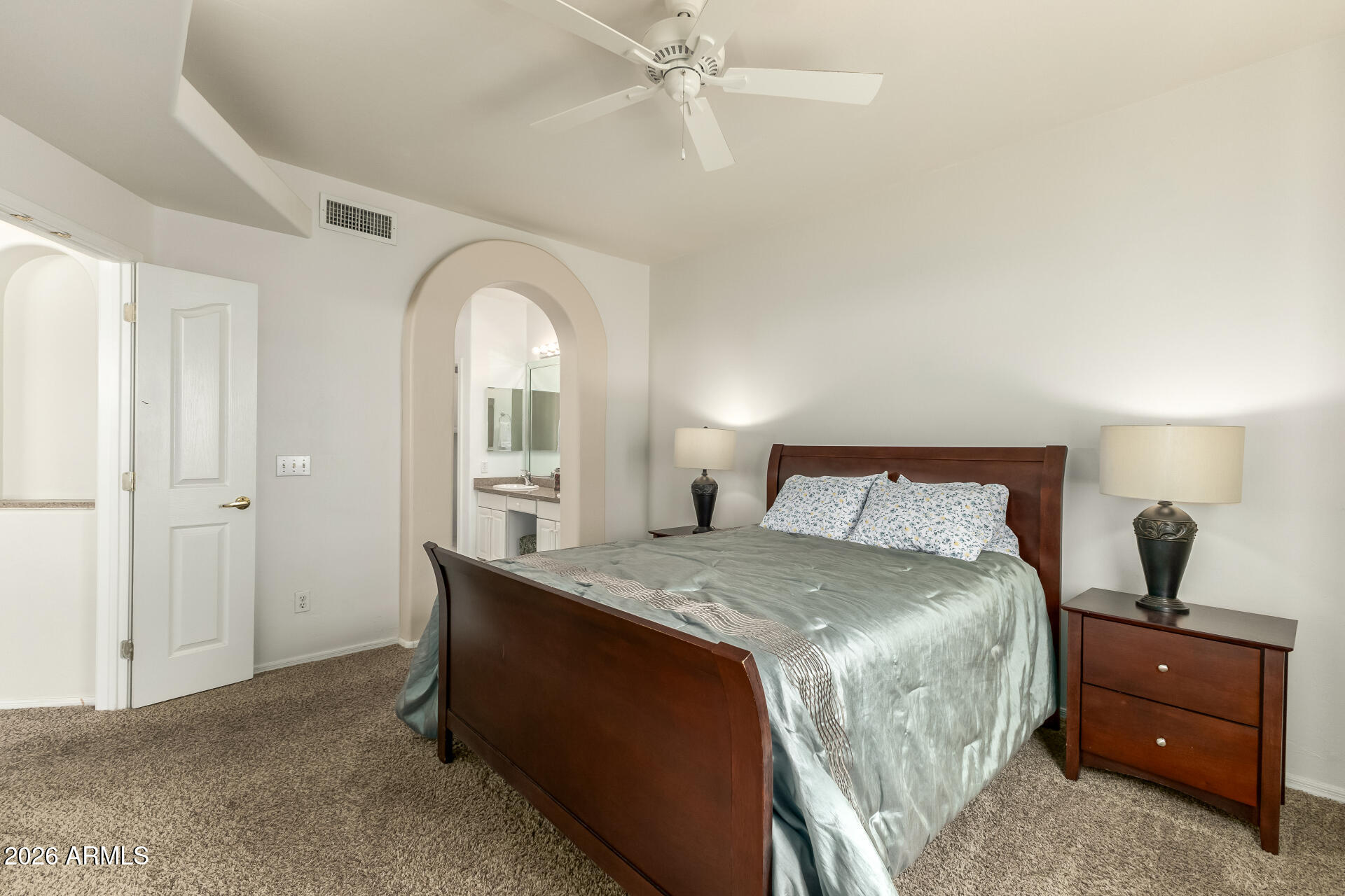 5445 East McKellips Road, Unit 23 Mesa, AZ 85215 - Photo 14 of 32 a bedroom with a bed and a window