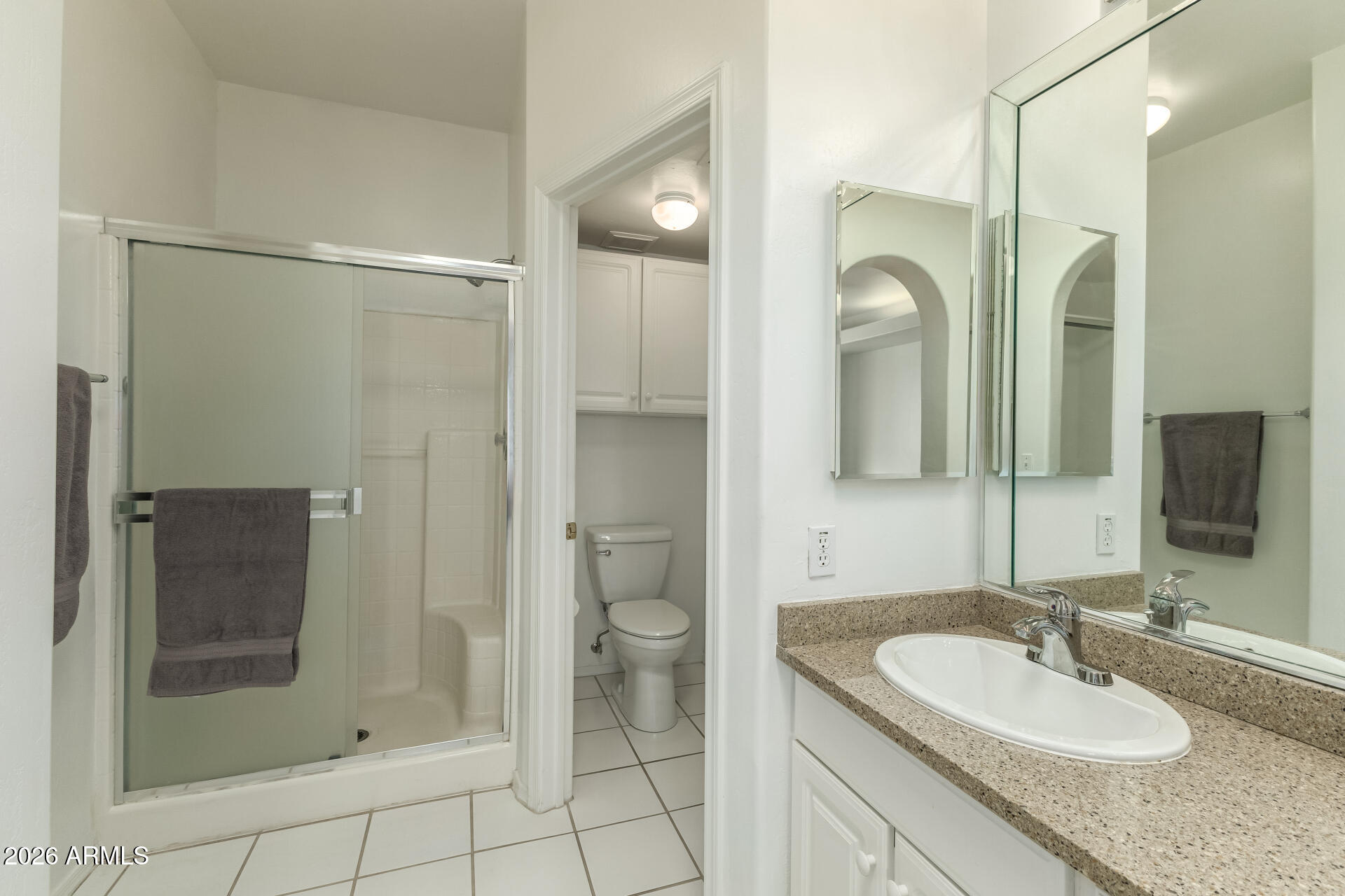 5445 East McKellips Road, Unit 23 Mesa, AZ 85215 - Photo 16 of 32 a bathroom with a shower sink and mirror