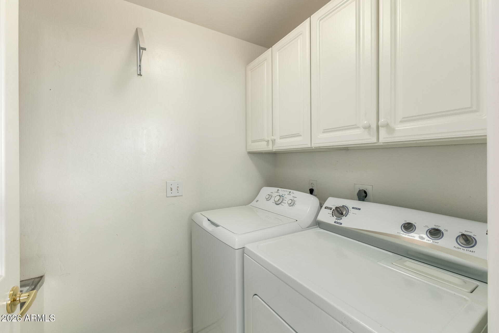 5445 East McKellips Road, Unit 23 Mesa, AZ 85215 - Photo 21 of 32 a utility room with dryer and washer