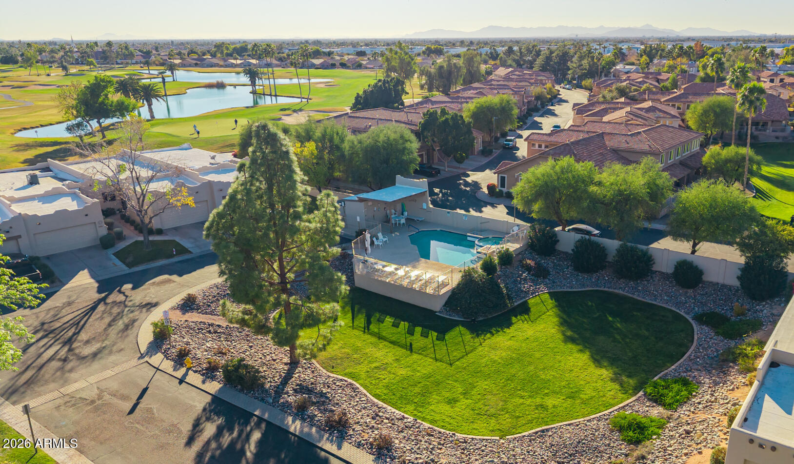5445 East McKellips Road, Unit 23 Mesa, AZ 85215 - Photo 26 of 32 an aerial view of a house with swimming pool outdoor seating and yard