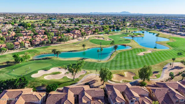 a view of a swimming pool patio and outdoor seating