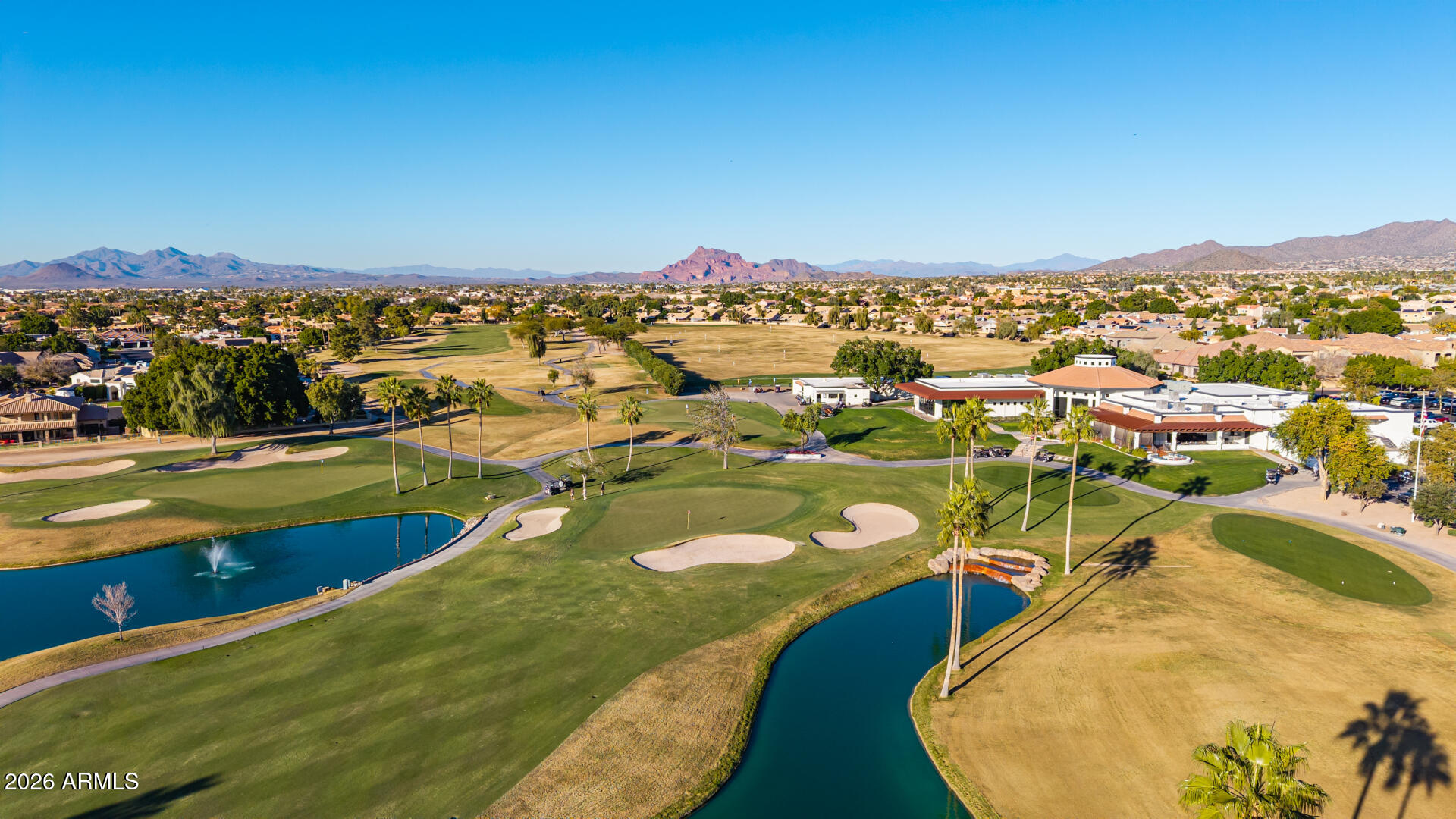 5445 East McKellips Road, Unit 23 Mesa, AZ 85215 - Photo 32 of 32 a view of a lake with a mountain