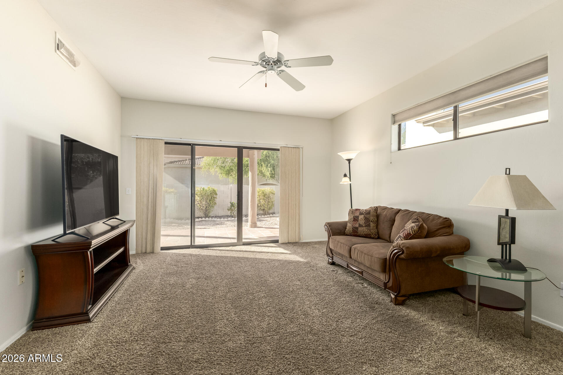 5445 East McKellips Road, Unit 23 Mesa, AZ 85215 - Photo 5 of 32 a living room with furniture and a flat screen tv