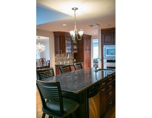 111 Sutton Road Needham, MA 02492 - Photo 14 of 30 a kitchen with a table and chairs in it