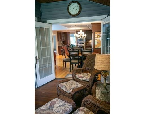 111 Sutton Road Needham, MA 02492 - Photo 17 of 30 a living room with furniture and a clock