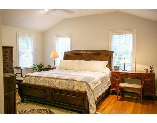 111 Sutton Road Needham, MA 02492 - Photo 18 of 30 a bedroom with a bed table and window