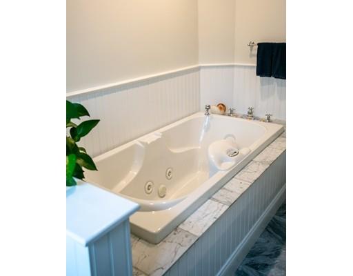 111 Sutton Road Needham, MA 02492 - Photo 19 of 30 a bath tub sitting in a bathroom and sink