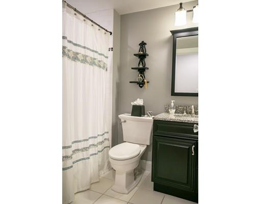 111 Sutton Road Needham, MA 02492 - Photo 23 of 30 a bathroom with a sink a toilet and shower curtain