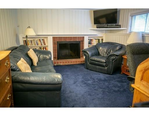 111 Sutton Road Needham, MA 02492 - Photo 24 of 30 a living room with furniture and a flat screen tv