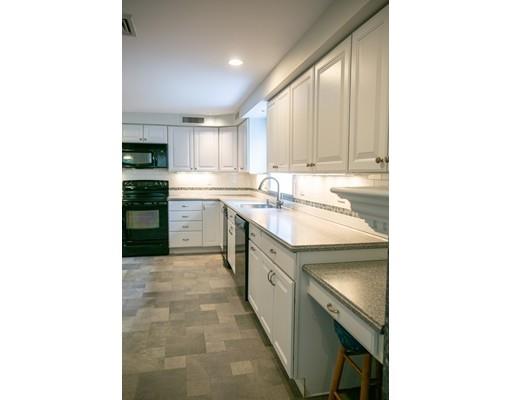 111 Sutton Road Needham, MA 02492 - Photo 25 of 30 a kitchen with a sink cabinets and appliances