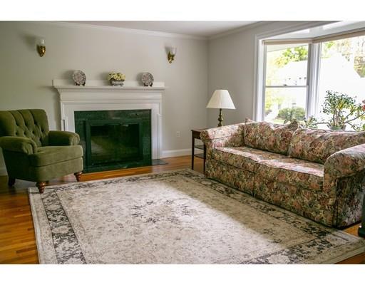 111 Sutton Road Needham, MA 02492 - Photo 7 of 30 a living room with furniture and a fireplace
