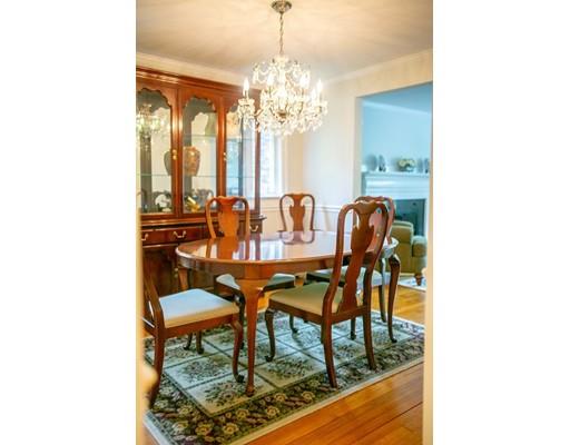 111 Sutton Road Needham, MA 02492 - Photo 8 of 30 a view of a dining room with furniture and chandelier