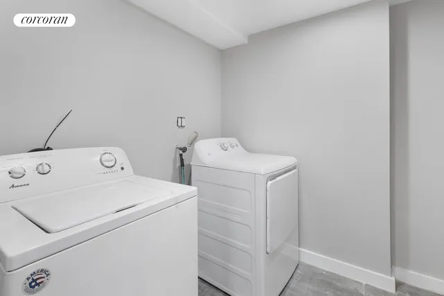 a living room with furniture and stairs