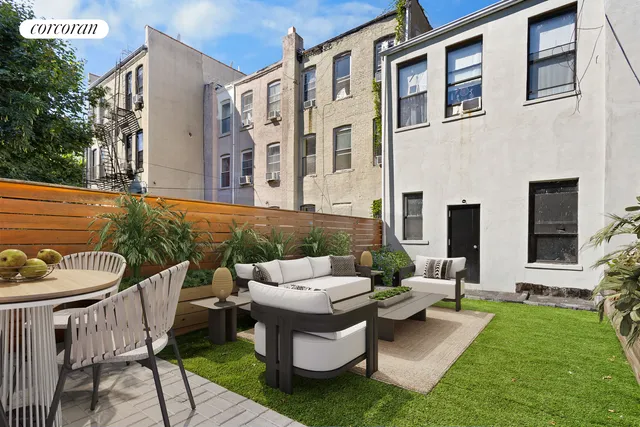 a outdoor living space with furniture and a garden