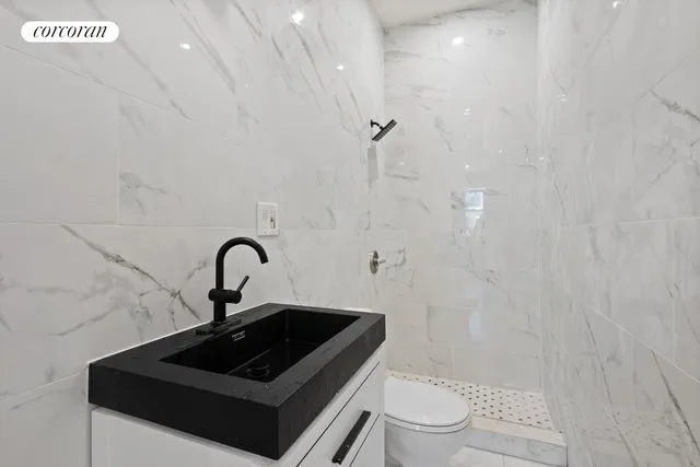 a bedroom with a bed and a wall painting