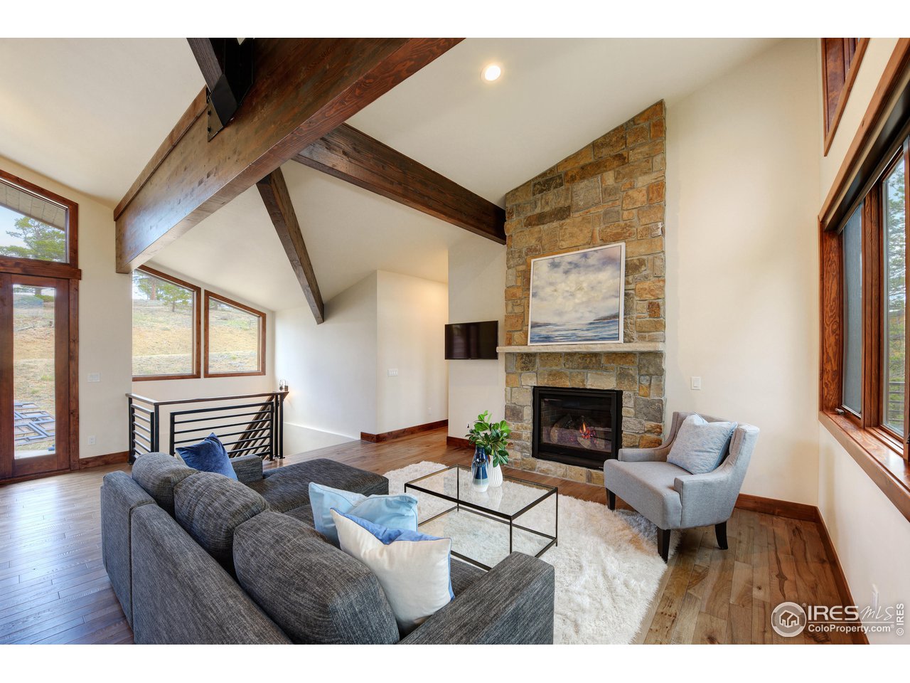 23 Ridge View Road Nederland, CO 80466 - Photo 5 of 38 a living room with furniture and a fireplace