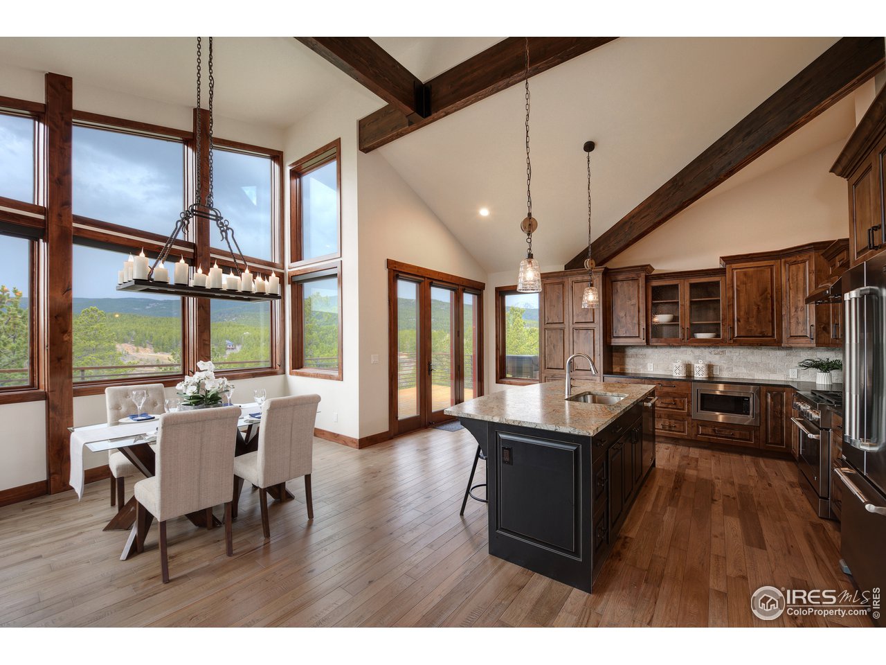 23 Ridge View Road Nederland, CO 80466 - Photo 8 of 38 a view of a dining room with furniture window and wooden floor