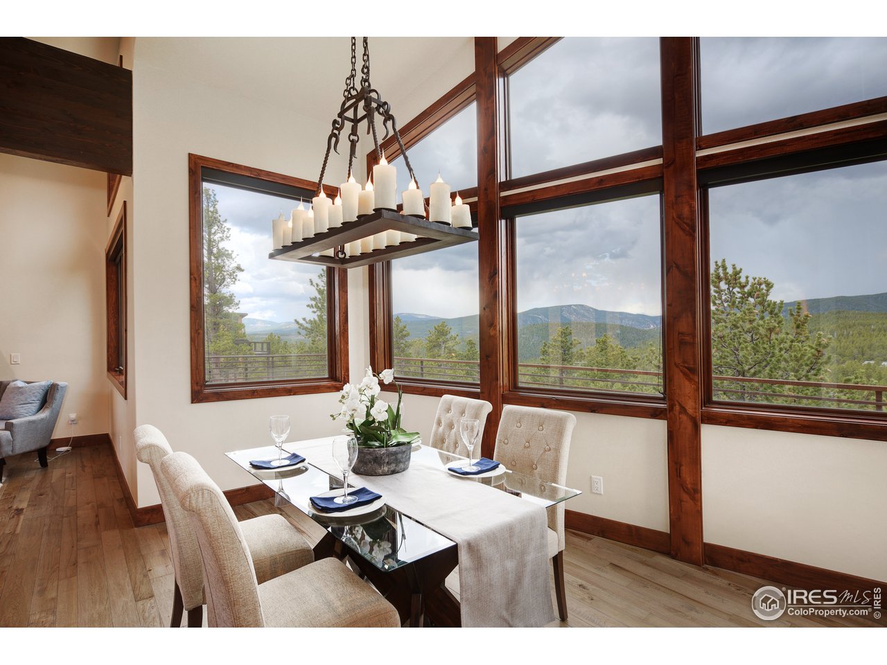 23 Ridge View Road Nederland, CO 80466 - Photo 10 of 38 a dining room with furniture and large windows