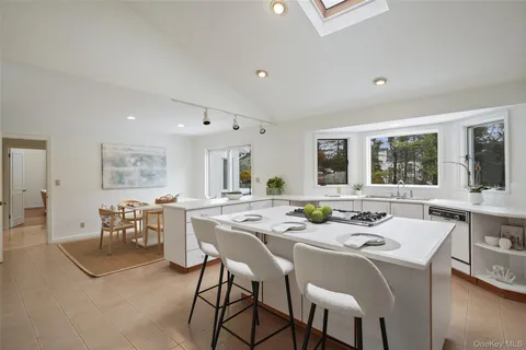 a dining room with a table and chairs