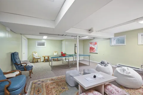 a living room with furniture and a rug