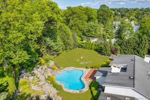 an aerial view of a house having yard