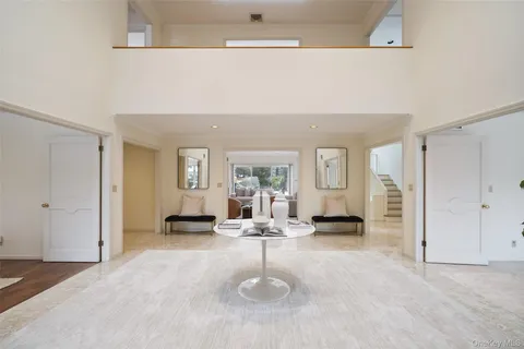 a view of a livingroom with furniture and windows