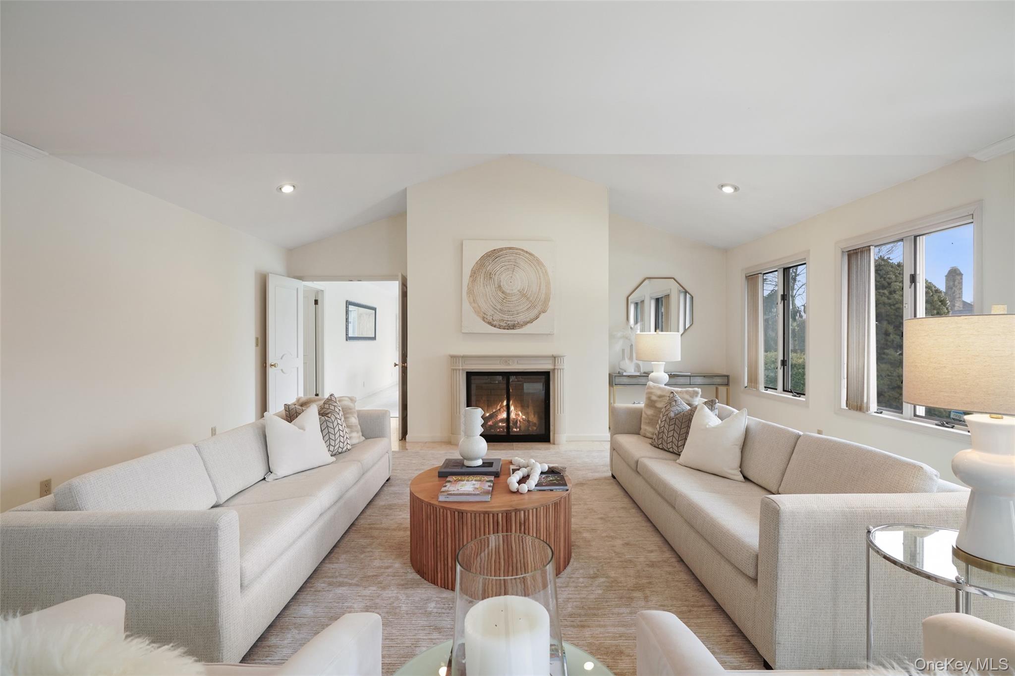 14 Lakeside Drive Rye, NY 10580 - Photo 5 of 33 a living room with furniture a fireplace and a large window