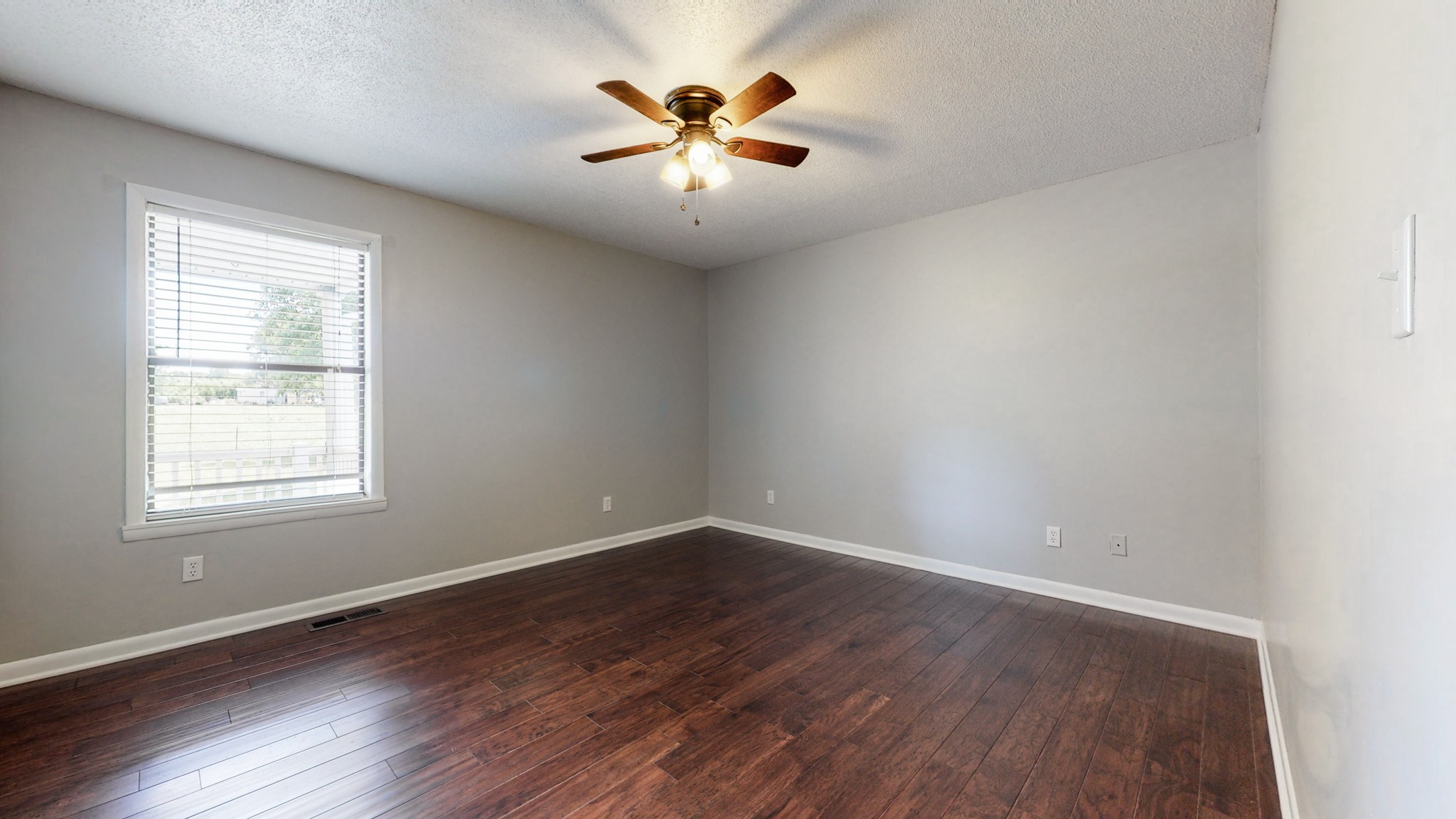 83 Hotel Road Flintville, TN 37335 - Photo 12 of 39 an empty room with window and ceiling fan