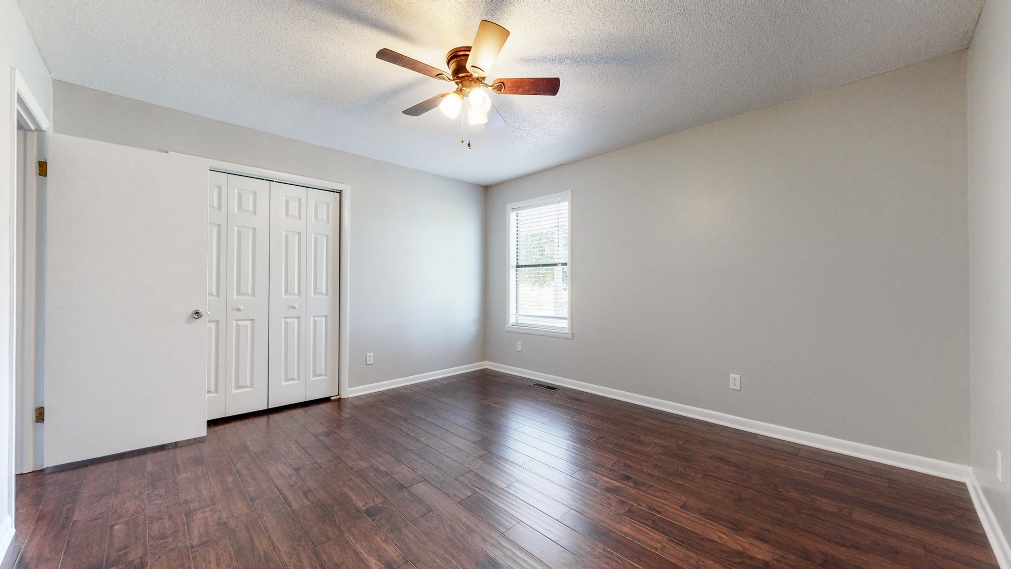 83 Hotel Road Flintville, TN 37335 - Photo 15 of 39 an empty room with wooden floor and windows