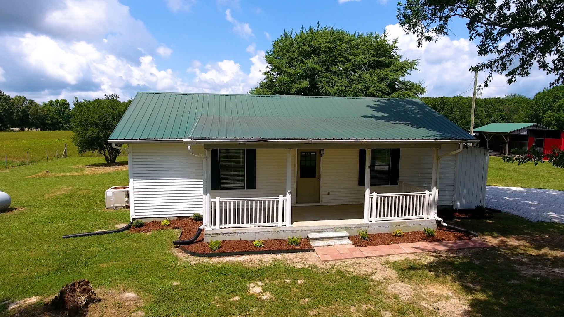 83 Hotel Road Flintville, TN 37335 - Photo 20 of 39 a front view of a house with garden