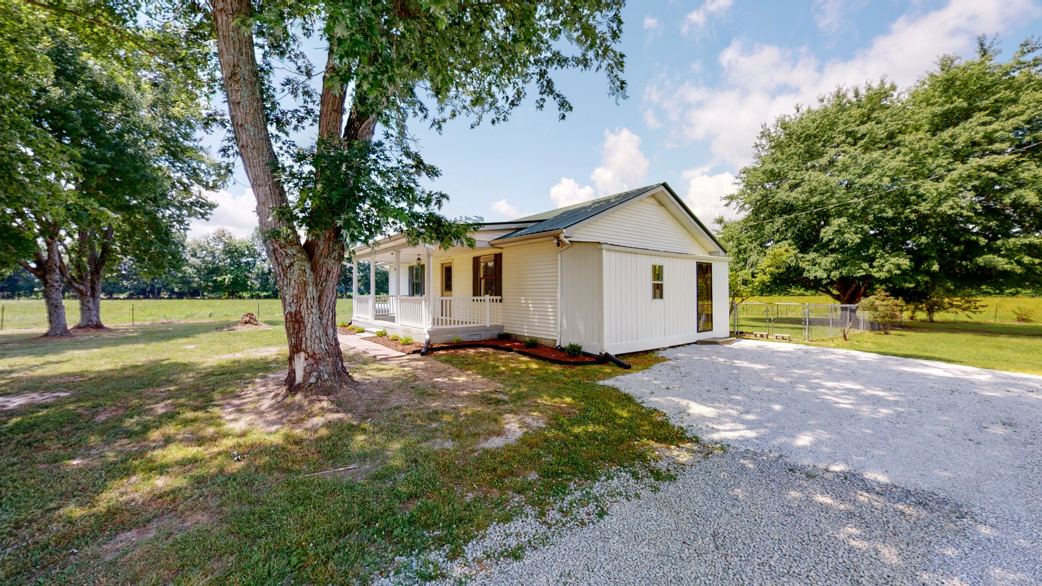 83 Hotel Road Flintville, TN 37335 - Photo 22 of 39 a view of a house with a yard and large tree